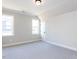 Bedroom with carpet floors and two windows at 167 Edgefield St, Pittsboro, NC 27312