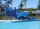Enjoy the community pool with a large blue slide on a sunny day at 167 Edgefield St, Pittsboro, NC 27312