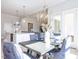 Open-concept dining area with stylish seating and adjacent to the kitchen at 167 Edgefield St, Pittsboro, NC 27312