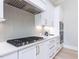 Close-up of a modern kitchen featuring stainless steel appliances and a stylish backsplash at 167 Edgefield St, Pittsboro, NC 27312