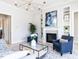 Bright living room with a modern fireplace, built-in shelving, and stylish furniture at 167 Edgefield St, Pittsboro, NC 27312