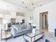 Bright living room with a modern kitchen, comfortable seating, and contemporary decor at 167 Edgefield St, Pittsboro, NC 27312
