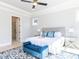 Bright main bedroom with a large window, tray ceiling, and stylish decor at 167 Edgefield St, Pittsboro, NC 27312