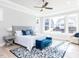 Bright main bedroom with a large window, tray ceiling, and stylish decor at 167 Edgefield St, Pittsboro, NC 27312