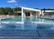 Relaxing swimming pool with chairs in the water at 167 Edgefield St, Pittsboro, NC 27312