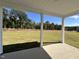 Covered patio overlooking a spacious grassy backyard at 345 Maidenhair Pl, Clayton, NC 27520