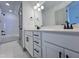 Modern bathroom with double vanity, quartz countertop, and black accents at 345 Maidenhair Pl, Clayton, NC 27520