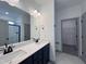 Modern bathroom with double vanity and walk-in closet at 345 Maidenhair Pl, Clayton, NC 27520