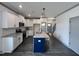 Open kitchen with white cabinets, granite countertops, and a center island at 345 Maidenhair Pl, Clayton, NC 27520