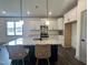 Bright kitchen featuring a spacious island and granite countertops at 345 Maidenhair Pl, Clayton, NC 27520