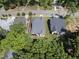 Aerial view showcasing a neighborhood with well-maintained homes, tree-lined streets, and lush greenery at 5307 Dixon Dr, Raleigh, NC 27609