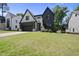 Charming home with stylish finishes, manicured lawn, and inviting curb appeal in a leafy neighborhood at 5307 Dixon Dr, Raleigh, NC 27609
