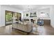 Bright living room with fireplace, wood floors, and sliding doors to the outside at 5307 Dixon Dr, Raleigh, NC 27609