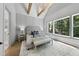 Vaulted main bedroom with wood beams, chandelier, paneled wall, and a large window at 5307 Dixon Dr, Raleigh, NC 27609