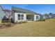 The beautiful backyard features a covered patio and well-maintained lawn at 2009 Abbeyhill Dr # 63, Raleigh, NC 27610