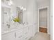 Well-lit bathroom features double vanity with quartz countertop and tiled floors at 2009 Abbeyhill Dr # 63, Raleigh, NC 27610