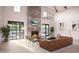 Bright living room with a stone fireplace, chandelier lighting, and sliding doors to outdoor space at 2009 Abbeyhill Dr # 63, Raleigh, NC 27610