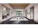 Grand lobby with wood ceiling, stone fireplace, modern furniture and natural light at 2009 Abbeyhill Dr # 63, Raleigh, NC 27610