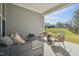 Covered patio with comfortable seating and views of the yard at 2009 Abbeyhill Dr # 63, Raleigh, NC 27610