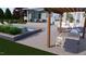 Backyard with a barbecue, pergola and inground pool and spa for upscale outdoor living at 213 Westhampton Dr, Pittsboro, NC 27312