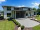 Large patio for outdoor entertaining in a well-manicured backyard with modern architectural design at 213 Westhampton Dr, Pittsboro, NC 27312