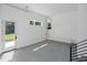 Unfinished basement with access to the backyard featuring epoxy floor, gas tankless water heater at 213 Westhampton Dr, Pittsboro, NC 27312
