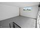 Unfinished basement featuring a window, epoxy floors, and stairs leading down from the main level at 213 Westhampton Dr, Pittsboro, NC 27312