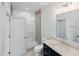 Well-lit bathroom featuring a glass-enclosed shower, modern fixtures, and sleek tile work at 213 Westhampton Dr, Pittsboro, NC 27312