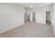 Spacious bedroom with neutral carpet, ceiling fan, and multiple doorways leading to other rooms at 213 Westhampton Dr, Pittsboro, NC 27312