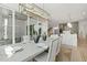 Airy dining space with access to patio, complemented by a sleek lighting fixture and modern finishes at 213 Westhampton Dr, Pittsboro, NC 27312