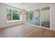 Bright dining room with grand chandelier and sliding doors to the back yard at 213 Westhampton Dr, Pittsboro, NC 27312