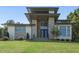 Striking contemporary home with a stone and siding exterior, manicured lawn, and modern design at 213 Westhampton Dr, Pittsboro, NC 27312