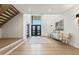 Grand entrance with high ceilings, statement lighting and modern staircase at 213 Westhampton Dr, Pittsboro, NC 27312