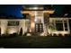 Inviting front entrance featuring modern architectural design, stylish stone accents, and sophisticated outdoor lighting at 213 Westhampton Dr, Pittsboro, NC 27312