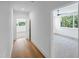 Hallway features hardwood floors and leads to bedrooms offering scenic views at 213 Westhampton Dr, Pittsboro, NC 27312