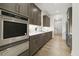 Chef's kitchen featuring stainless steel appliances, double oven, and hardwood floors at 213 Westhampton Dr, Pittsboro, NC 27312