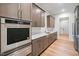 Kitchen showcasing stainless steel appliances, custom cabinets, and quartz countertops at 213 Westhampton Dr, Pittsboro, NC 27312