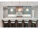 Modern kitchen with a large marble island and a view of the exterior at 213 Westhampton Dr, Pittsboro, NC 27312