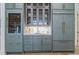 Stylish kitchen with modern appliances, a built-in wine cooler, and elegant cabinetry with brass hardware and fixtures at 213 Westhampton Dr, Pittsboro, NC 27312
