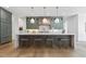 A beautifully designed kitchen featuring an expansive island, stylish cabinetry, and pendant lighting that elevates the space at 213 Westhampton Dr, Pittsboro, NC 27312