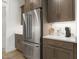 Modern kitchen with stainless steel refrigerator, stylish cabinets, and bright countertop space at 213 Westhampton Dr, Pittsboro, NC 27312