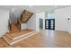 Open living space with stairs to the second floor and modern decor at 213 Westhampton Dr, Pittsboro, NC 27312