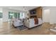 Living room boasts modern fireplace, comfortable seating, and large sliding doors to extend entertainment space at 213 Westhampton Dr, Pittsboro, NC 27312