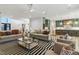 Spacious living room with an open floor plan, comfortable seating, and modern design elements at 213 Westhampton Dr, Pittsboro, NC 27312
