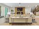 Living room features neutral furnishings, hardwood floors, fireplace, and modern decor at 213 Westhampton Dr, Pittsboro, NC 27312