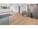Open loft features hardwood floors, railings, modern lighting, and an accent wall with custom trim at 213 Westhampton Dr, Pittsboro, NC 27312