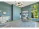 Bright office features neutral decor, glass desk, stylish chandelier, and bright walls at 213 Westhampton Dr, Pittsboro, NC 27312