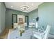 Bright office with glass desk and modern decor featuring glass doors that leads to additional space at 213 Westhampton Dr, Pittsboro, NC 27312