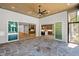 Elegant patio with stone floor, ceiling fan, and open access to other parts of the home at 213 Westhampton Dr, Pittsboro, NC 27312