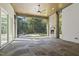 Outdoor patio featuring a stone fireplace, wood ceiling, and views of the backyard at 213 Westhampton Dr, Pittsboro, NC 27312